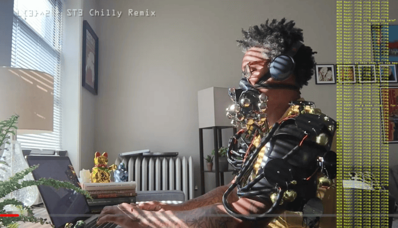 Everyday Cyborg wearing a gas mask device with bells