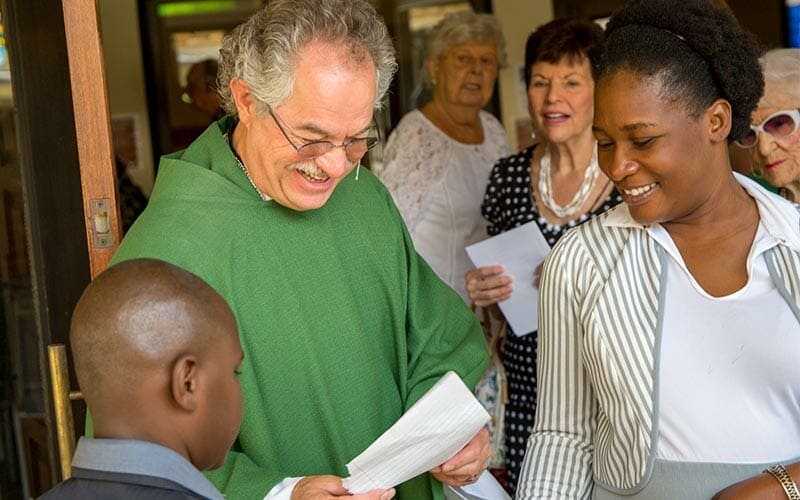 Marie and family give Pastor Steve Wigdahl a note of thanks