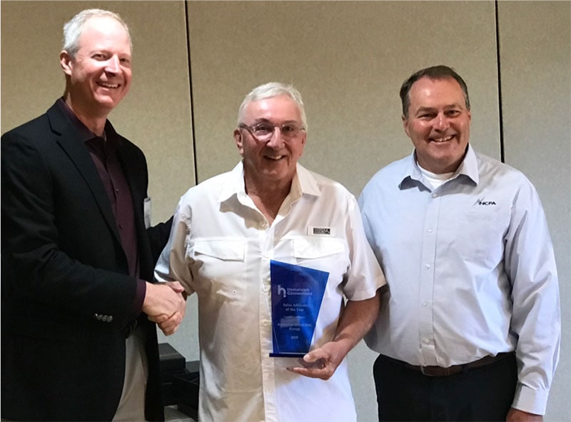 American Municipal Power President & CEO Mark Gerken of accepts the 2019 Sales Affiliate of the Year Award on behalf the organization. Presented by Hometown President & CEO Tim Blodgett (left) and Board Chair/NCPA General Manager Randy Howard.