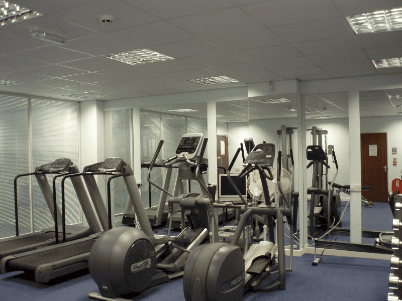 Gym with an equipment in front of the mirror