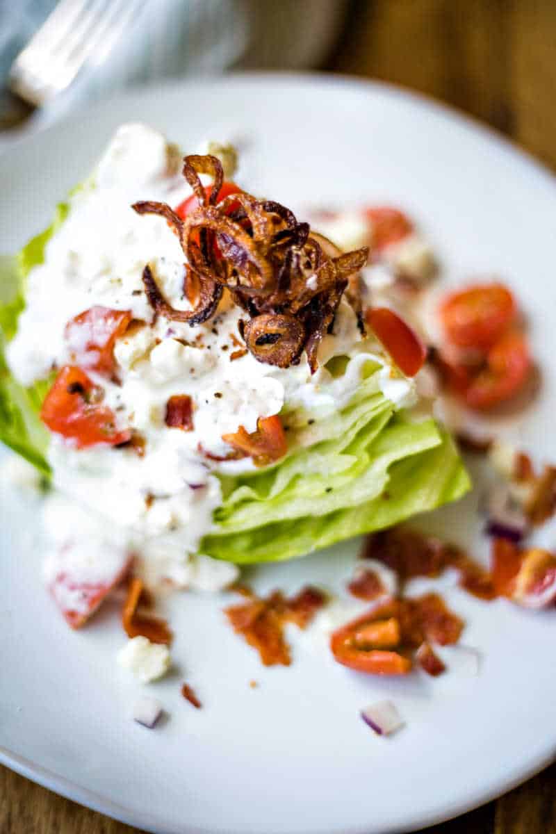 crispy shallots on a wedge salad with buttermilk blue cheese dressing