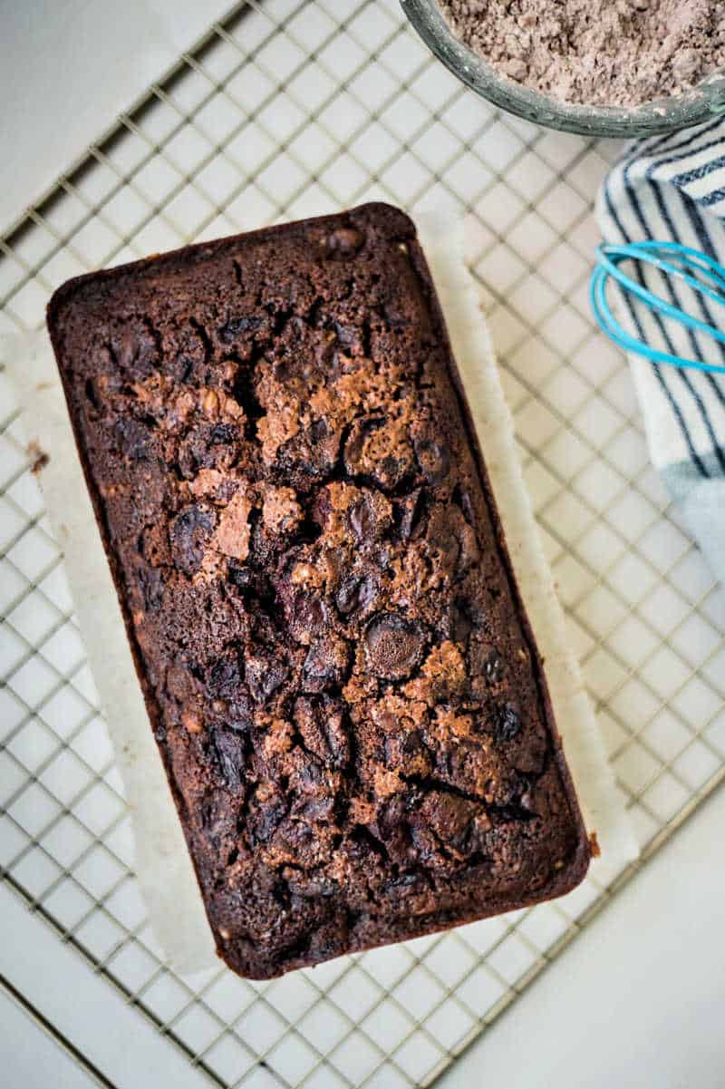chocolate cherry loaf cake on a wire rack
