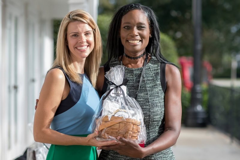 Brooke Bargeron Statham, WC '00, presents Terry Capers, BU '14, with the Service to Brenau Award as part of the Alumni Awards during the homecoming celebrations at Brenau University. (AJ Reynolds/Brenau University)