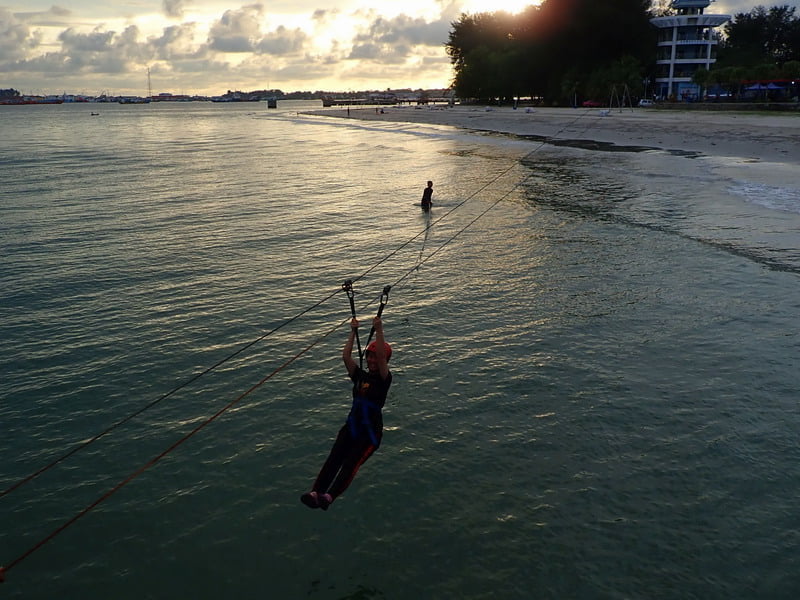 4. Emily in the middle of the zipline (photo courtesy of rambleandwander.com)