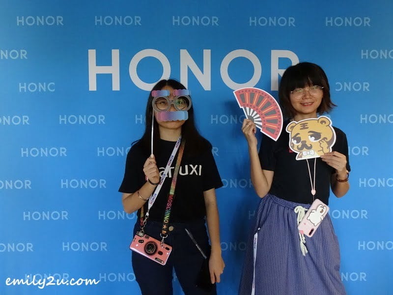 Wanuxi staff taking photos with props