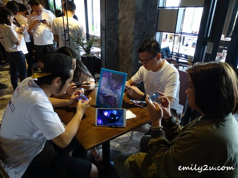 guests at the event playing the latest mobile games