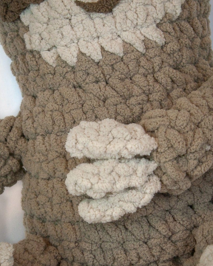 One skein of yarn and you can have this adorable plush sloth! He is easy to create using only the basic stitches. He is quick and great for beginners. This is a wonderful free crochet pattern. #crochet #pattern #free #amigurumi