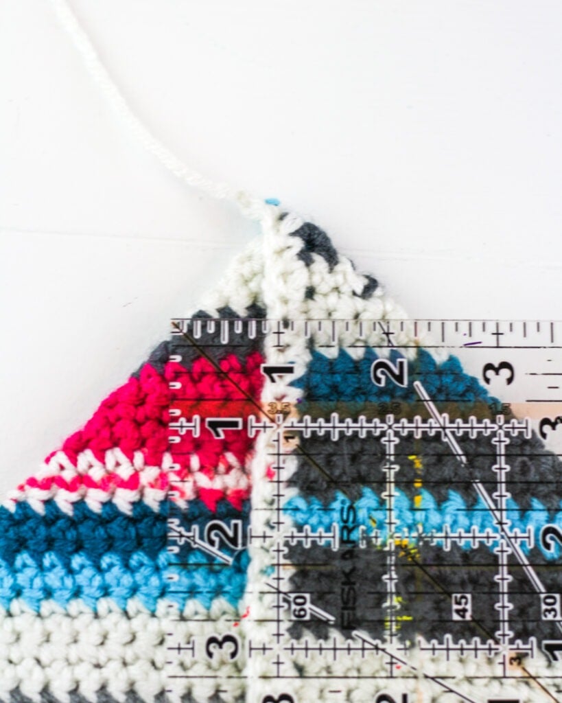 Make a cute boho style bag from your yarn scraps. This Crochet Scraps bag is beginner friendly and I will even show you how I completed it without sewing. #crochetbag #crochettote #scrapyarn