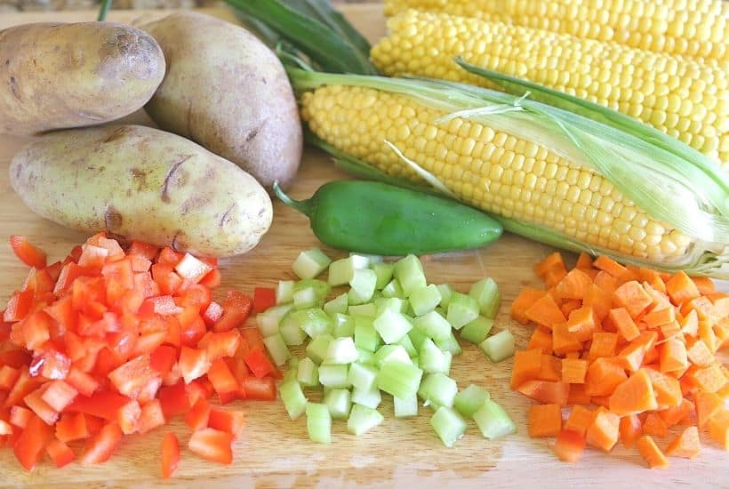 Warm up on a cold day with a bowl of this hearty Chicken Corn Chowder. This easy soup recipe is Loaded with chicken, corn, bacon, cheese, potatoes. This delicious chowder recipe is a winner! This soup recipe is easy to make and freezer-friendly, perfect for dinner any night of the week.