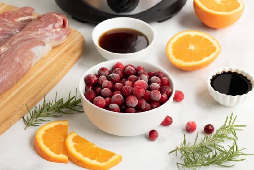 This Slow Cooker Pork Tenderloin With Cranberries & Orange is a delicious fix it and forget it holiday Crock Pot recipe.