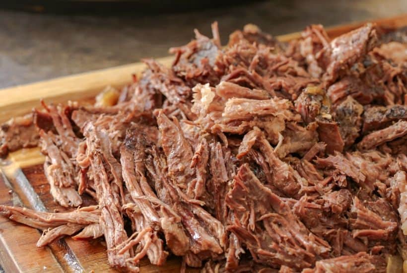 These flavorful Easy Crock Pot French Dip Sandwiches are a family favorite. Top them with provolone cheese and serve with a side of au jus. This Slow Cooker French Dip Sandwich recipe is perfect for a weeknight meal or to serve at a game day party or casual get together. This is an easy sandwich recipe that everyone will enjoy. #frenchdip #slowcookerrecipe #crockpotrecipe #slowcookerfrenchdip