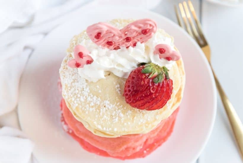 These Pink Ombre Pancakes are the perfect homemade Valentine's Day Pancake Recipe. Your family will love these light and fluffy pancakes. Share some love and make easy pancake recipe can be served all year long. #valentinesdaypancakes #ombrepancakes