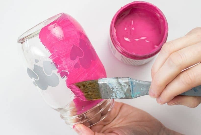 Grab some chalk paint and transform a mason jar into these Painted Mason Jar Valentine Lantern. This is an easy DIY Valentine's Day craft. Easy cricut craft project.