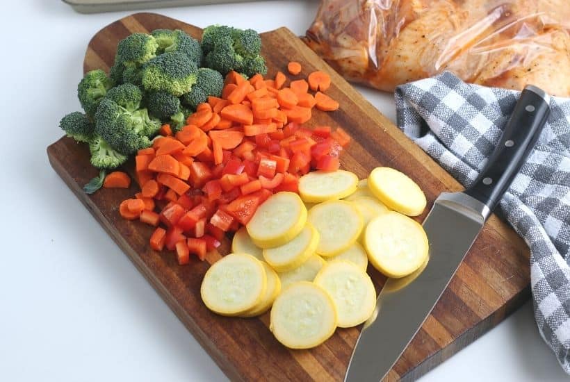 Want to make a delicious mess-free meal that is good for you? Try this health Sheet Pan Chicken and Vegetables Dinner consisting of chicken thighs, broccoli, carrots, and more! You will love this easy weeknight meal idea.