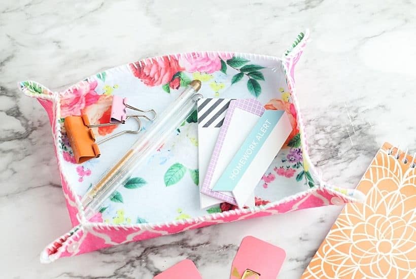 This simple DIY fabric tray is a fun sewing project you can make in just a few minutes. This easy craft project is perfect to display on your desk and use for home organization.