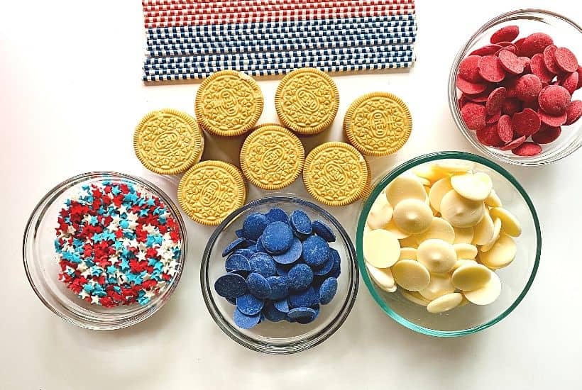 Patriotic Oreo Pops are a fun red, white and blue snack recipe to celebration the 4th of July or Memorial Day. Show you patriotic spirit and whip of a batch of these quick and easy cookie snacks.