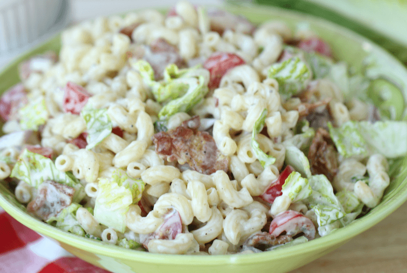 Everything is better with bacon! It's picnic season and this BLT Pasta Salad is the perfect summer salad recipe! This pasta salad recipe is filled with crispy bacon, fresh tomatoes and romaine. It is dressed with Litehouse Ranch Dressing. Save this kicked up macaroni salad recipe for your next backyard BBQ or picnic. #bltpastasalad #BLT #pastasalad #bacon #summersalad #macaronisalad
