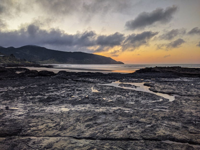 sunset on 90 mile beach at endless summer lodge in northland new zealand ahipara