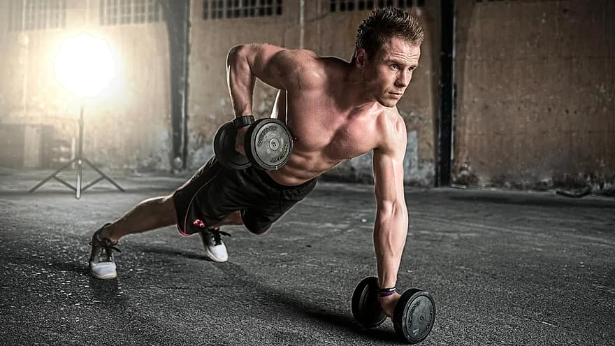 weightlifting workout - a guy pumping iron