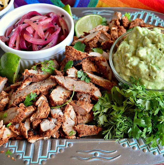 Mexican grilled pork, avocado cream, pickled onions