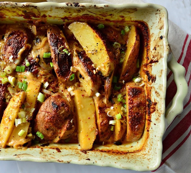 These rustic Mexican Scalloped Potatoes, Papas Anchos, are filled with cheese and crushed ancho chilies. Great with any grilled foods including burgers, these also are perfect with roast chicken! #potatoes #mexicanfood #chilies