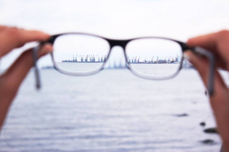 reading-glasses Looking an oilrig in the sea through the reading glasses
