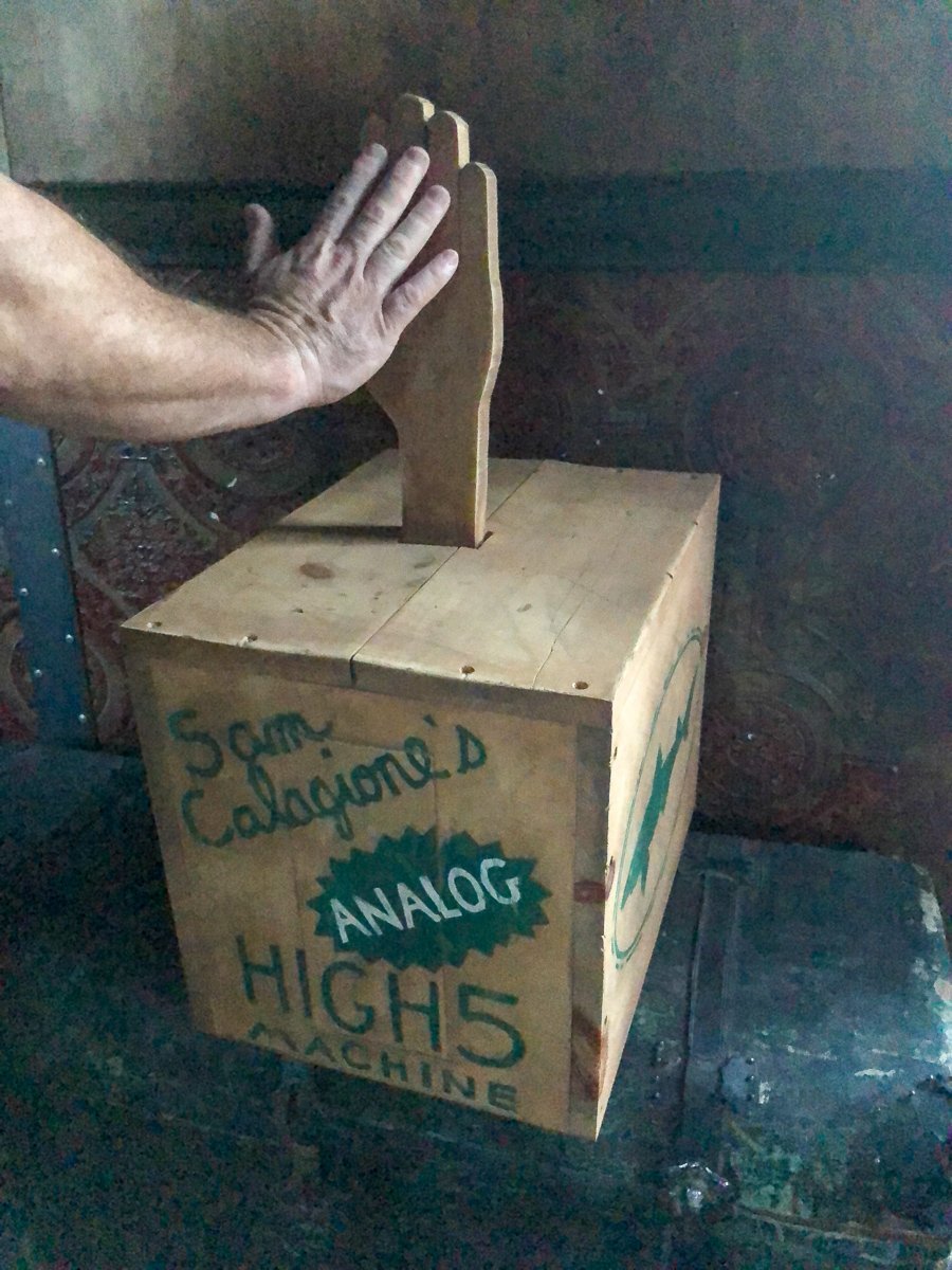 Inside the Steampunk Tree House at Dogfish Head in Milton, testing the analog high five machine.