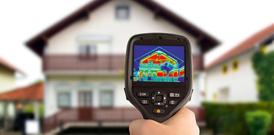 A thermal imaging camera showing where heat is escaping from a home.