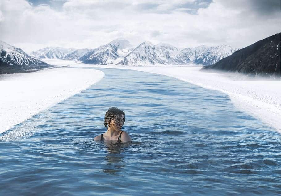a girl bathing outside during winter