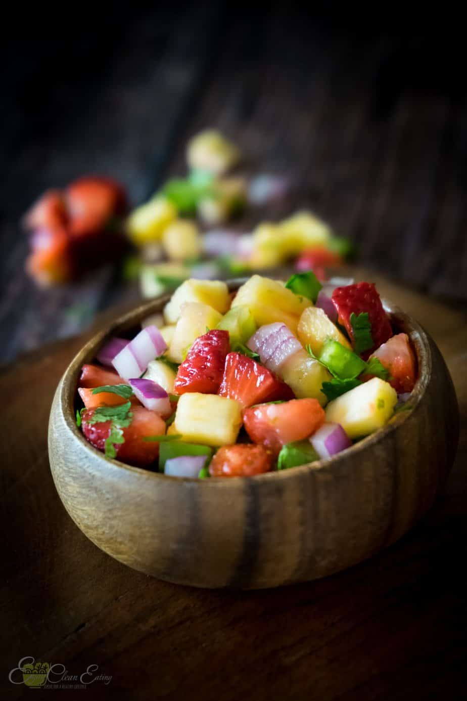 serve salad in a small wooden bowl with beautiful vibrant colors