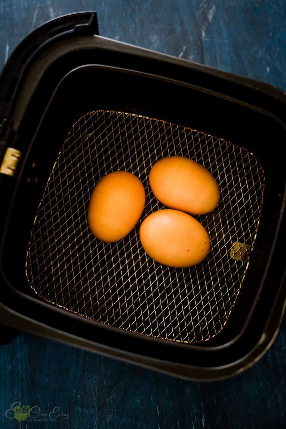 before cooking the eggs inside the basket of the air fryer