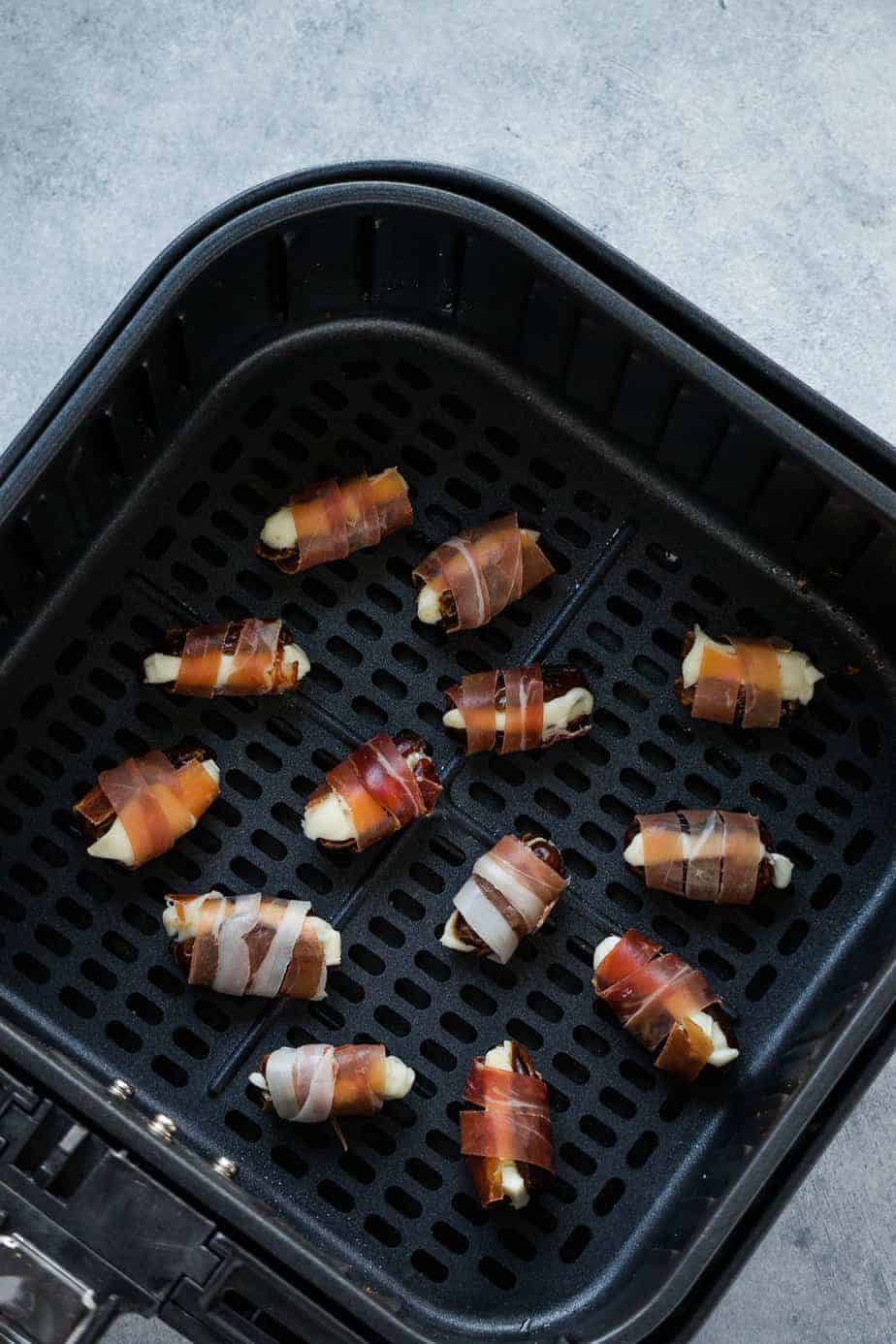 wrapped dates inside air fryer basket