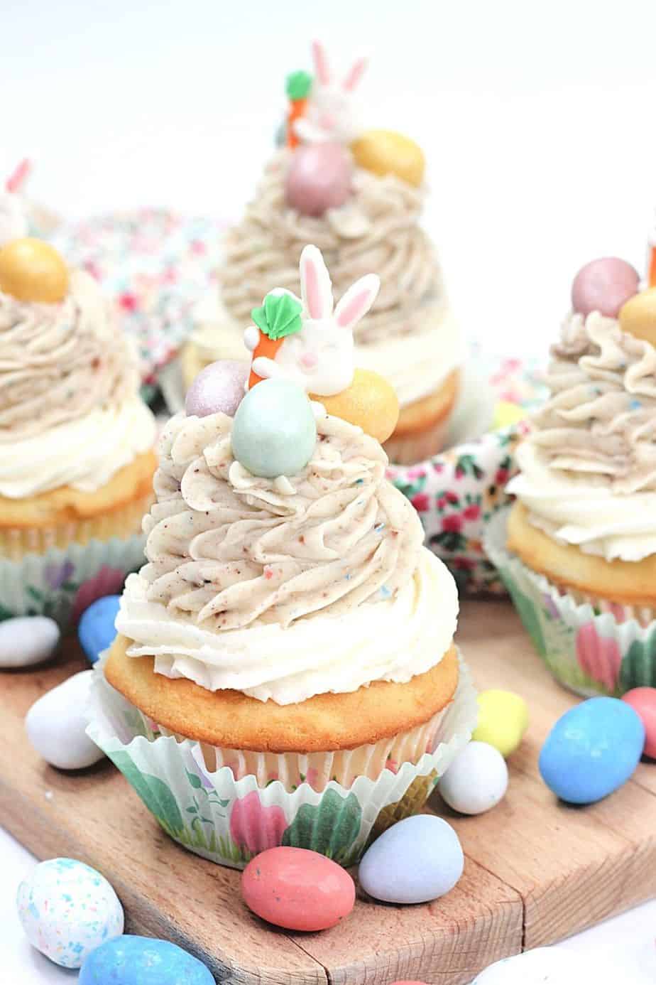 These Easter Egg Malt Cupcakes are a fun Easter cupcake recipe the whole family will enjoy. These cupcakes are easy to decorate and made with the classic malted easter eggs (or Whoppers).