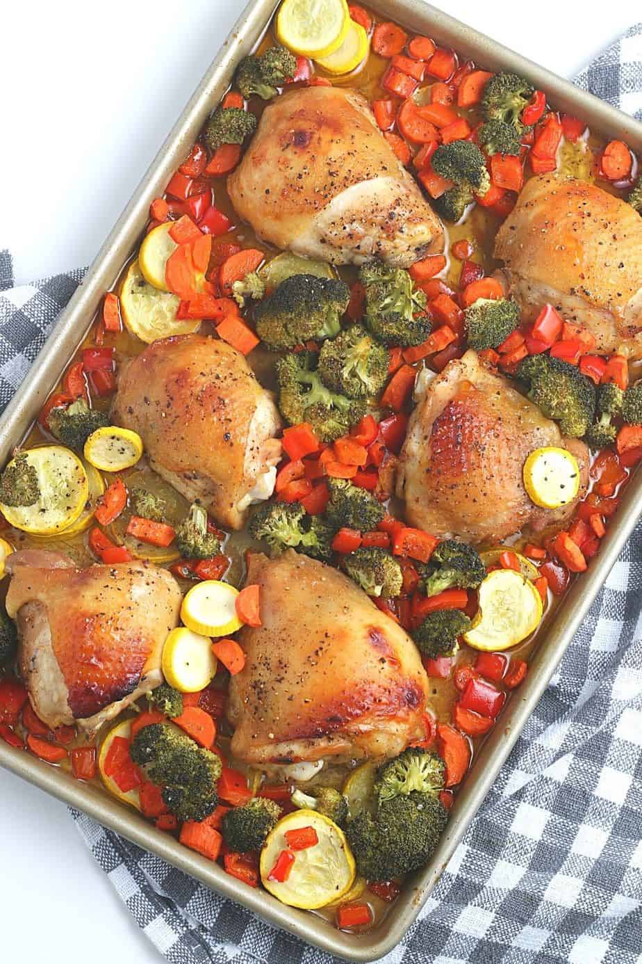 Want to make a delicious mess-free meal that is good for you? Try this health Sheet Pan Chicken Dinner consisting of chicken thighs, broccoli, carrots, and more! You will love this easy weeknight meal idea.