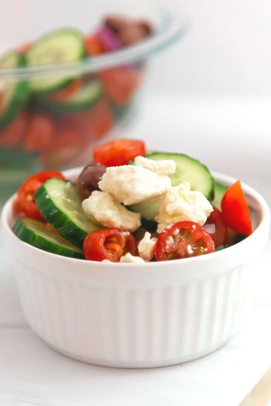 If you’d like a light and refreshing side dish, try this Greek Salad. It consists of healthy ingredients that are good for you, including cucumbers and red onions. This is an easy salad recipe to serve as a simple side dish, potluck recipe or at a summer picnic.
