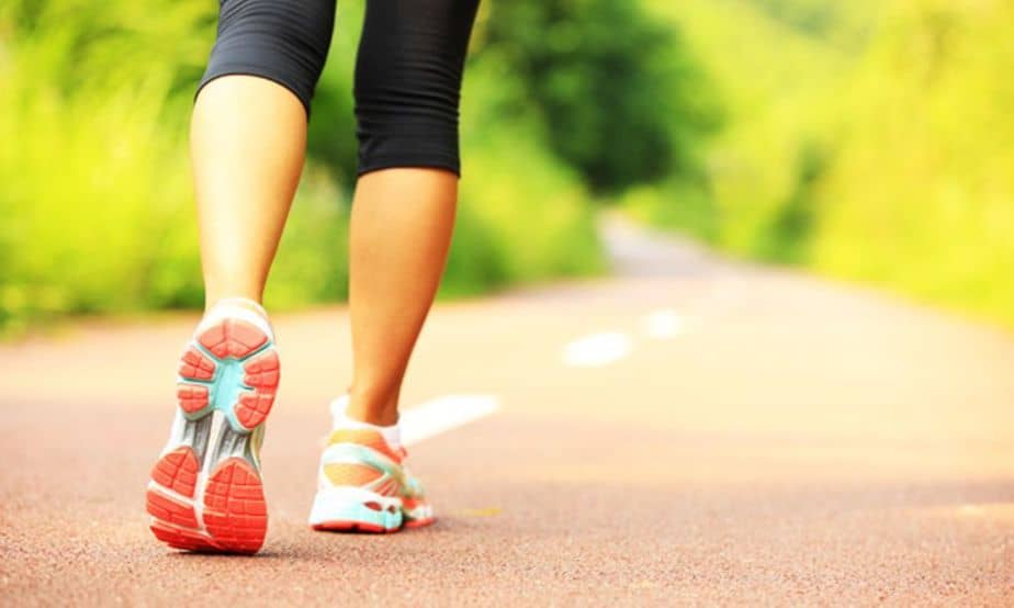 A girl has a short walk outdoors after overeating