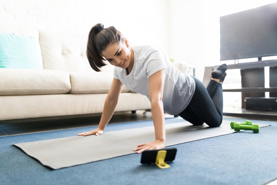 A girl has an online training at home