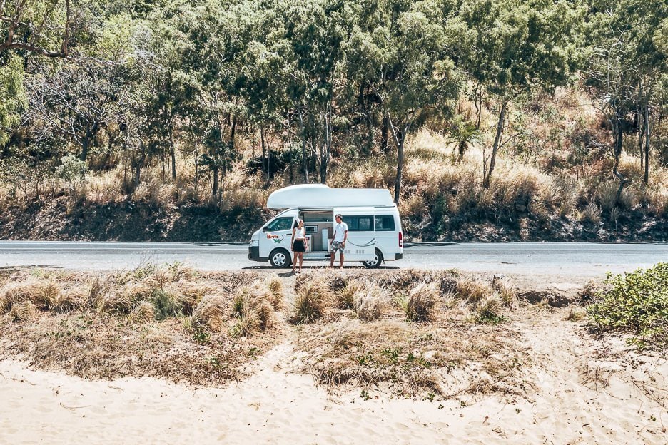 A Road Trip in Tropical North Queensland a 5 Day Campervan Itinerary from Cairns Back 16 L A couple stand in front of a Britz campervan on the Captain Cook Highway in Tropical north Queensland