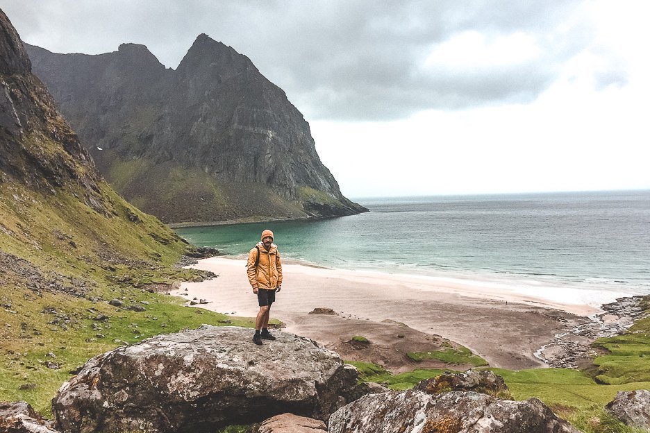 20 Amazing Photos of Norway That Will Leave You Breathless 14 L Bevan standing on a rock with Khalika Beach in the background - Lofoten Islands, Norway