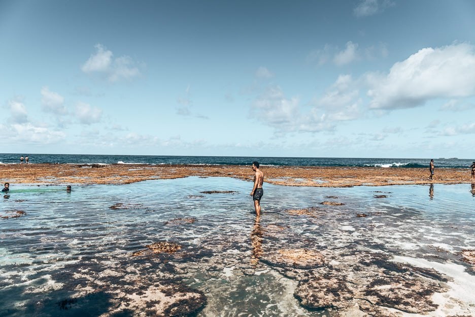 40 Stunning Photos That Will Make You Want To Visit The Philippines 39 L Wading through the shallow rock pools at Magpupungko, Siargao