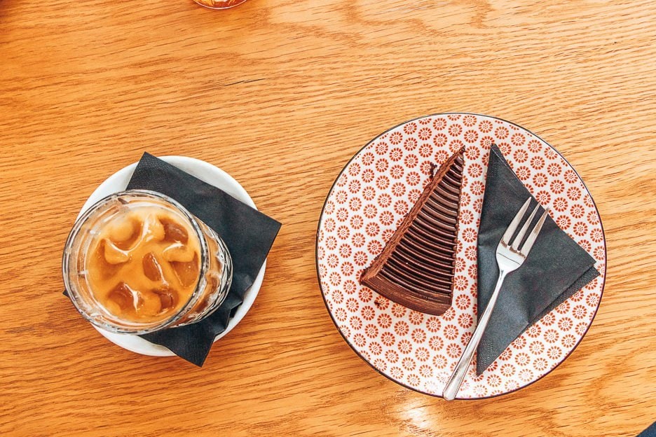 6 Amazing Third Wave Coffee Shops in Prague 5 L Iced coffee and chocolate cake at La Boheme Cafe, Prague