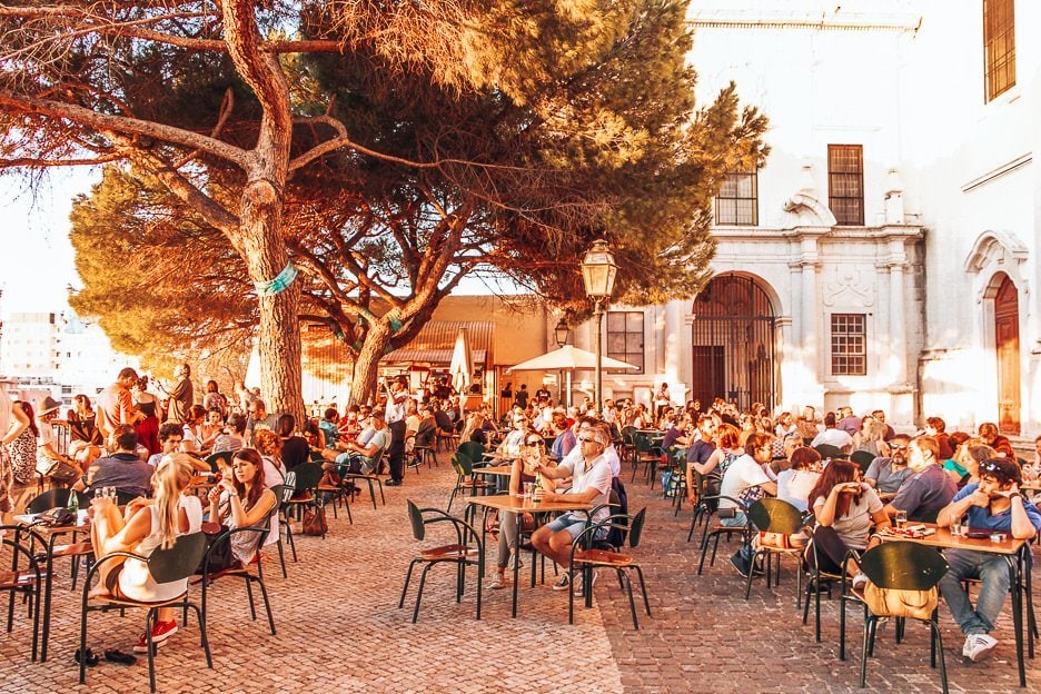 7 Useful Tips To Follow To Avoid Pickpockets 1 L Crowds sit in the afternoon sun at Terrace Bar Esplanada, Lisbon
