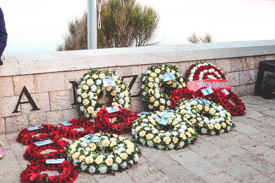 My Gallipoli Experience ANZAC Day Dawn Service 5 L White and red floral wreaths are laid at the ANZAC memorial in Gallipoli, Turkey