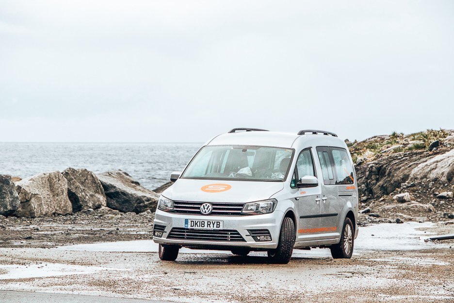 Planning A European Road Trip What You Should Know Before You Go 2 L Meteor campervan hired from Spaceship Rentals parked roadside in the Lofoten Islands, Norway