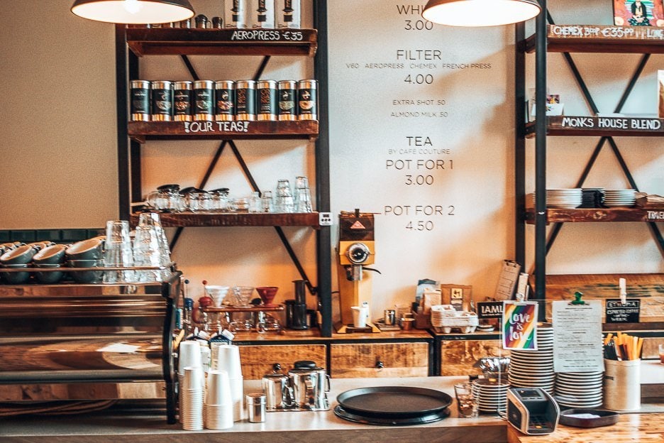 The Best Specialty Coffee In Amsterdam 10 Cafes You Should Visit 5 L Coffee counter and shelves at Monks Coffee Roasters