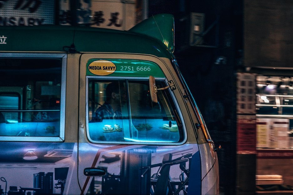 Under Neon Lights In Mong Kok Hong Kong 7 L A driver of a public light bus in the shadows, Mong Kok, Hong Kong