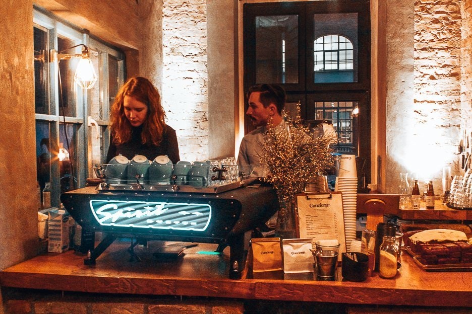 40 Cafes For The Best Coffee in Europe 10 L Two baristas preparing espresso coffees inside Concierge Coffee - some of the best coffee in Europe