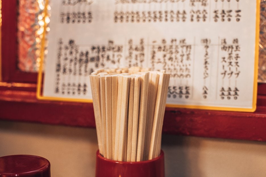 16 Useful Things To Know Before Travelling To Japan 6 L Wooden chopsticks in a restaurant in Tokyo, Japan