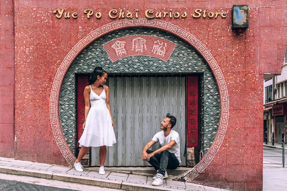 How To Spend 4 Days In Hong Kong 2 L a couple pose in the circular archway of Yue Po Chai Curios Store, Hong Kong