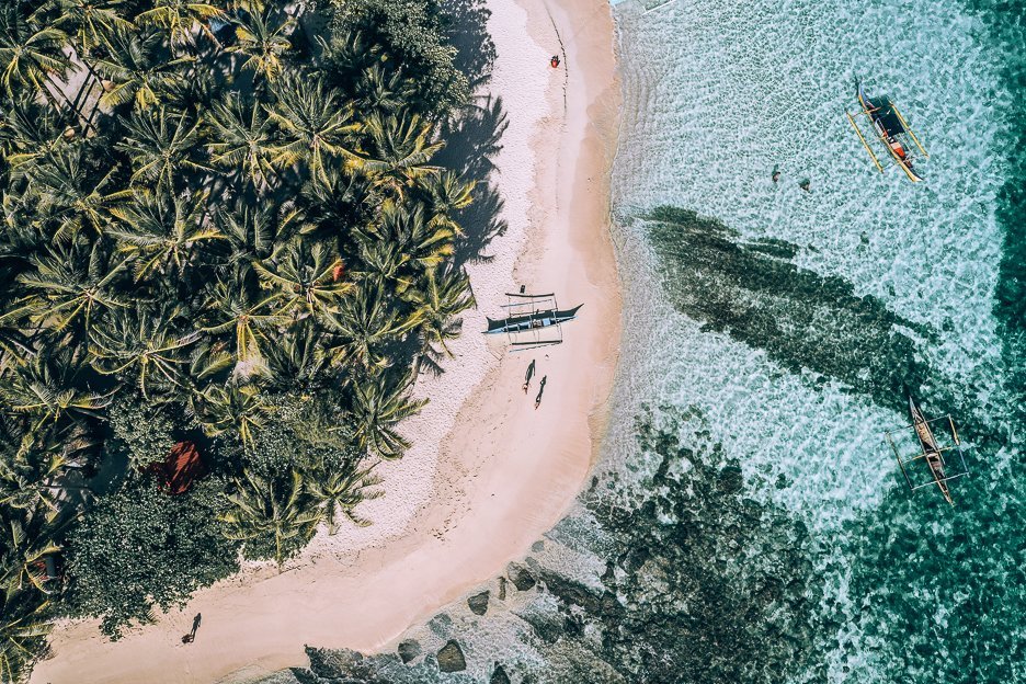 The Best Free Travel Apps For Exploring The World 3 L Aerial view of Guyam Island in Siargao, The Philippines